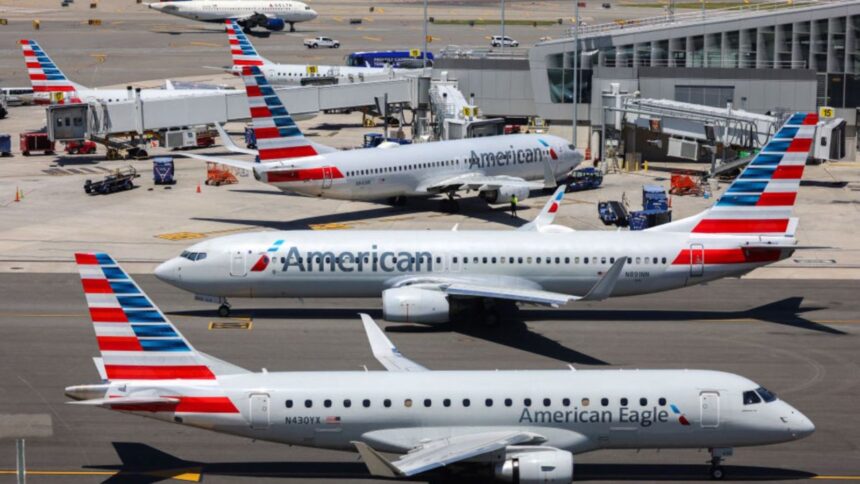 Several American Airlines aircraft parked at an airport awaiting further instructions