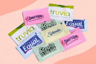 Several packets of artificial sweeteners neatly arranged for a photo shoot