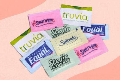 Several packets of artificial sweeteners neatly arranged for a photo shoot