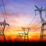 Cuba loses power again after a new energy grid collapse Several power transmission towers in Cuba with a beautiful sunset in the background