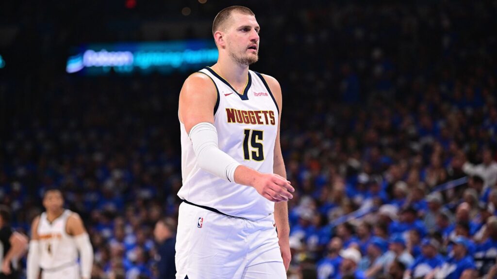 Jokic walking across the court after scoring a crucial point for his team
