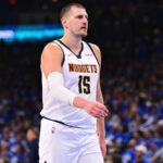 Jokic walking across the court after scoring a crucial point for his team