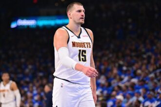 Jokic walking across the court after scoring a crucial point for his team