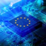 A small chip mounted on a motherboard featuring the flag of the European Union