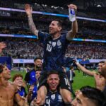 Lionel Messi being carried by his teammates after securing a dramatic victory