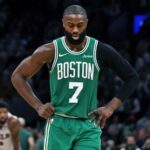 Jaylen Brown with his hands on his hips and a sad expression after being defeated by his current team, the Philadelphia 76ers