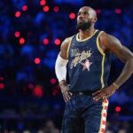 King LeBron looking up at the sky while wearing this year's NBA All-Star Game uniform