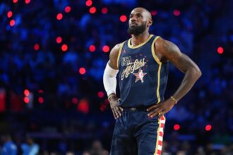 King LeBron looking up at the sky while wearing this year's NBA All-Star Game uniform
