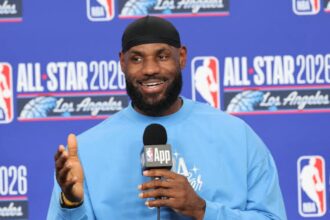 The now-free agent sitting at a press conference, looking very happy and smiling.