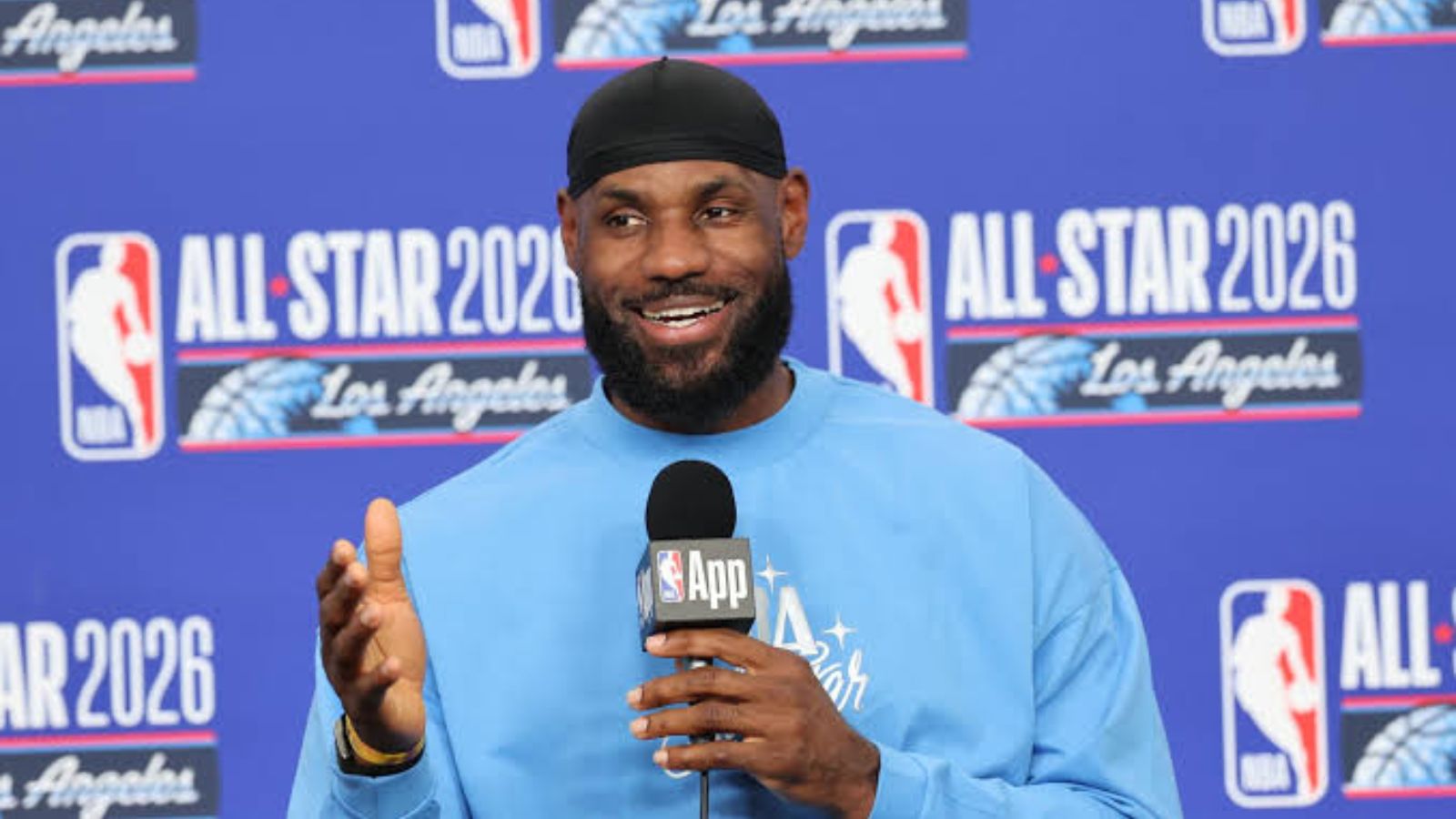 The now-free agent sitting at a press conference, looking very happy and smiling.