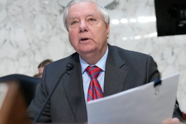 The prominent and well-known U.S. senator standing in the Senate, speaking into a microphone as his colleagues look on
