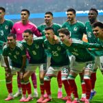 The 2026 Mexico national team huddled together and posing for the camera before a FIFA World Cup match