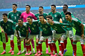 The 2026 Mexico national team huddled together and posing for the camera before a FIFA World Cup match