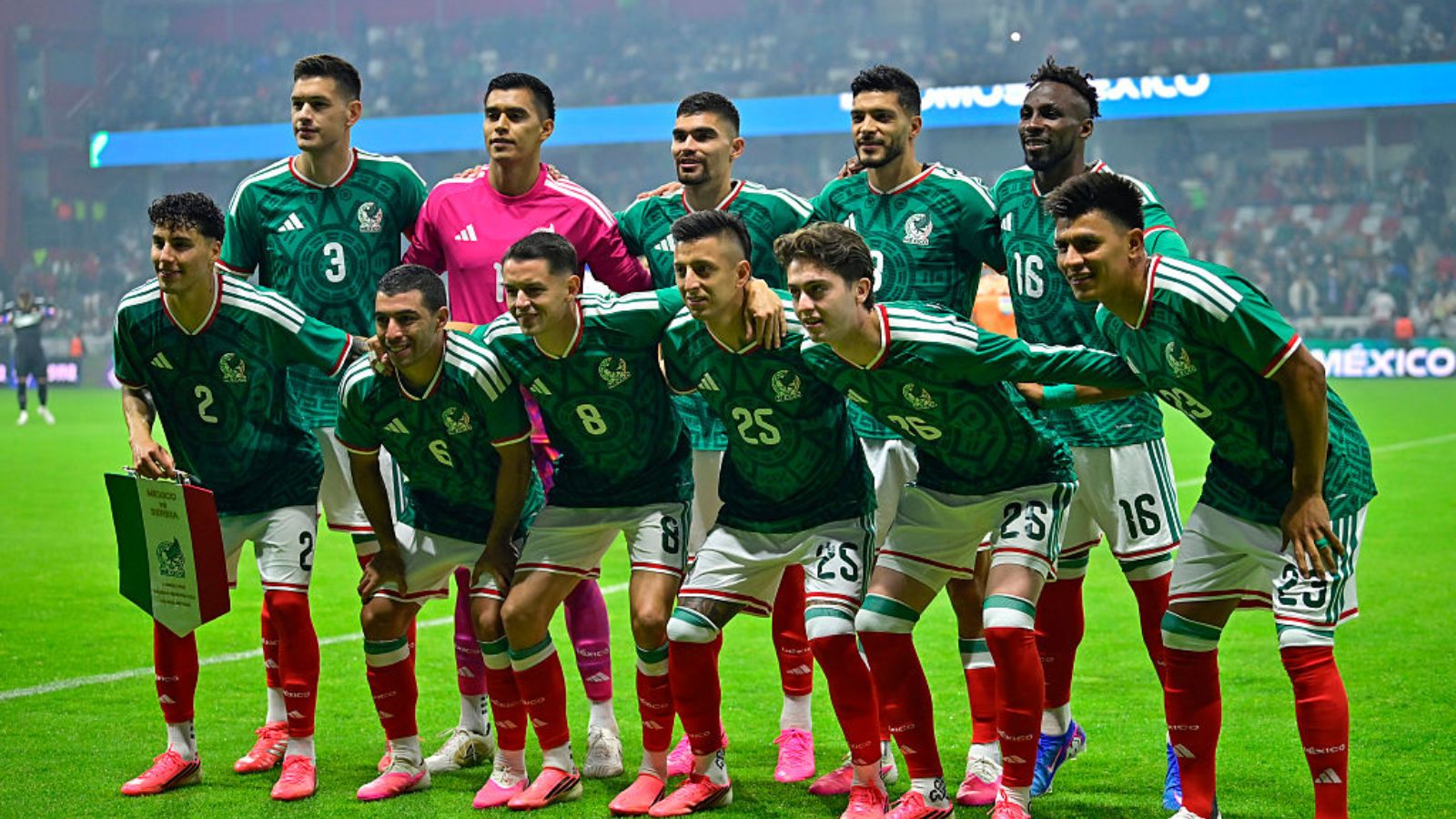 The 2026 Mexico national team huddled together and posing for the camera before a FIFA World Cup match