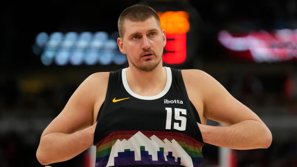 Nikola Jokić is beginning to lose patience with the Denver Nuggets Jokić adjusting his uniform before the start of a basketball game