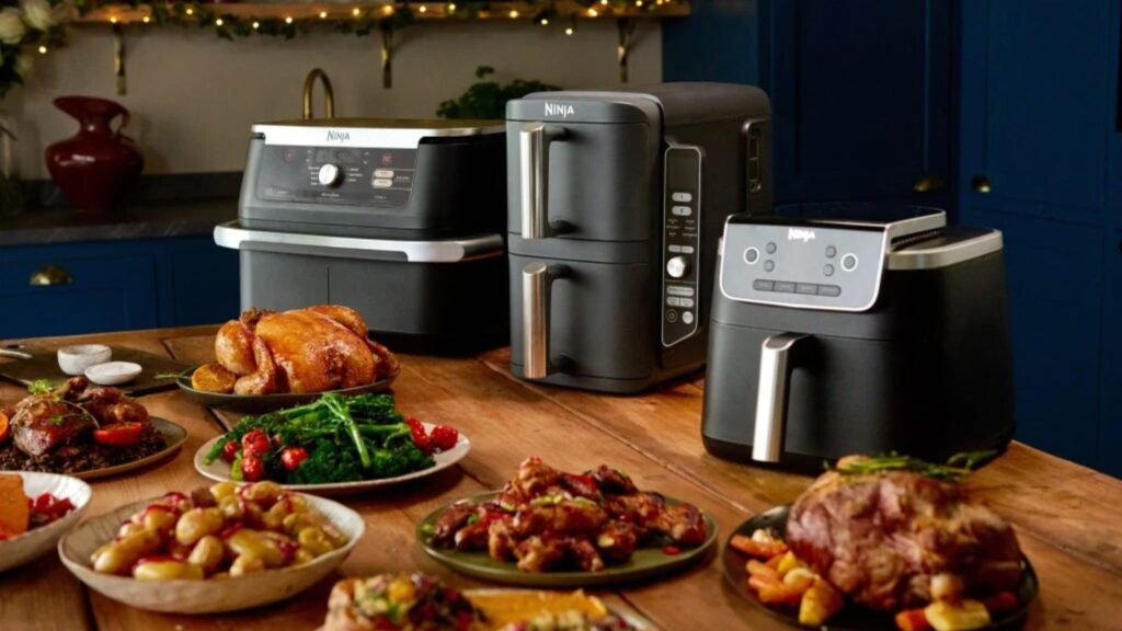 Ninja wins over home kitchens with discounts that delight food lovers Three Ninja products displayed on a table in front of a variety of foods prepared with them