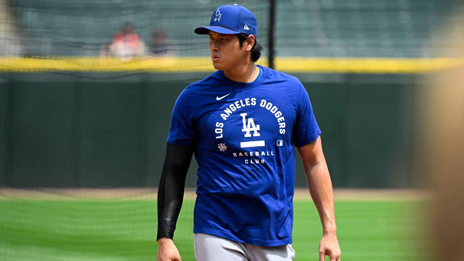 The Japanese superstar walking on the field wearing the Dodgers' practice uniform
