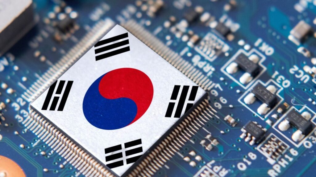 A small, high-tech microchip placed on a motherboard featuring the South Korean flag