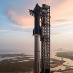 A SpaceX rocket in launch position, awaiting the command for liftoff