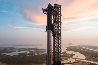 A SpaceX rocket in launch position, awaiting the command for liftoff