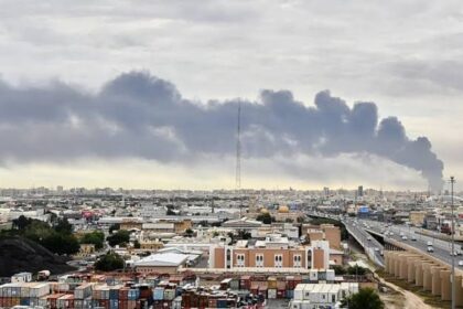 A Kuwaiti city engulfed in smoke in the aftermath of a missile attack