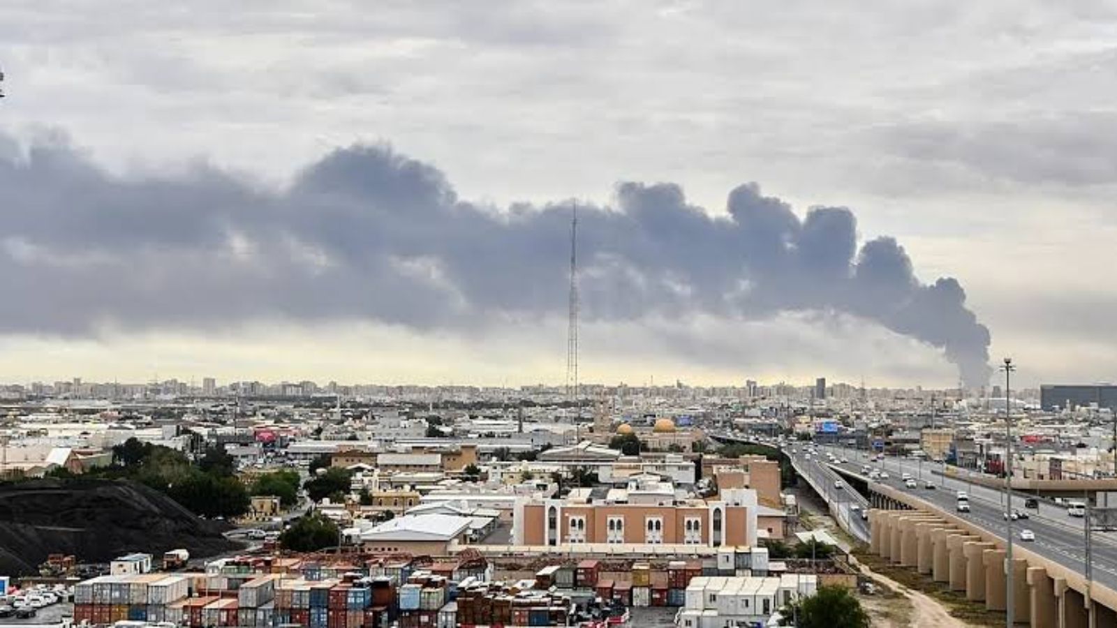 A Kuwaiti city engulfed in smoke in the aftermath of a missile attack