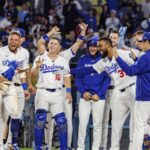The Dodgers players waiting at home plate for one of their teammates after he scored the game-winning run