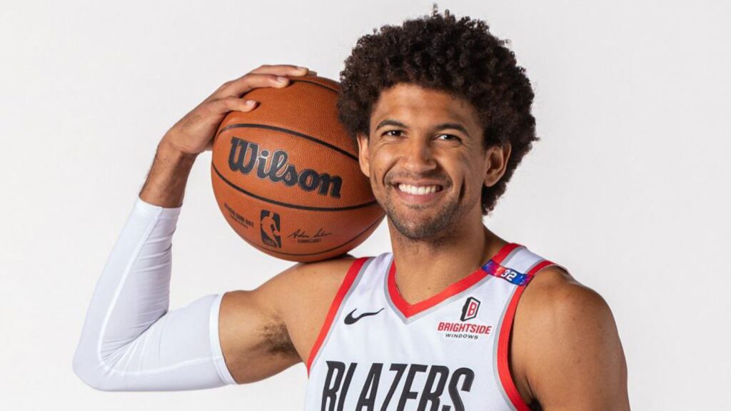 The Lakers trengthen their defense with the addition of Matisse Thybulle The Los Angeles Lakers' new player holding a basketball close to his face while posing for a photograph