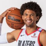 The Lakers trengthen their defense with the addition of Matisse Thybulle The Los Angeles Lakers' new player holding a basketball close to his face while posing for a photograph