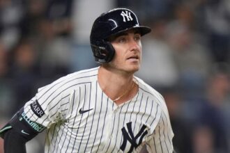 Bellinger watching the ball leave the field after a tremendous hit