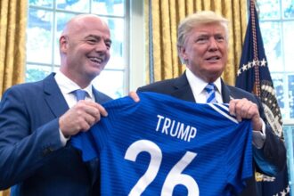 Infantino presenting Trump with a jersey bearing his name at the White House