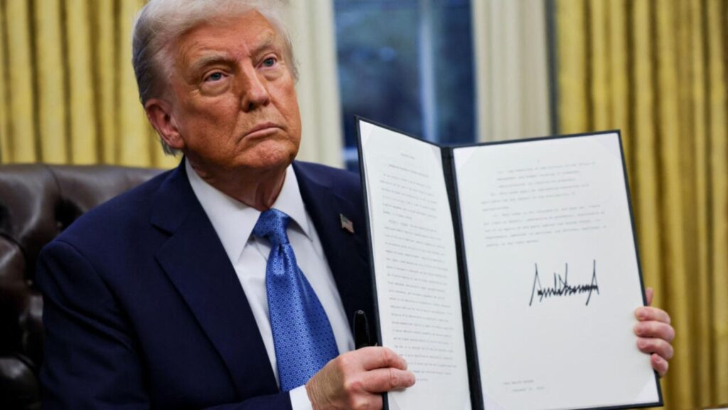 Trump proposes new fee that could impact global trade Donald Trump holding the tariff executive order, a large document bearing his signature