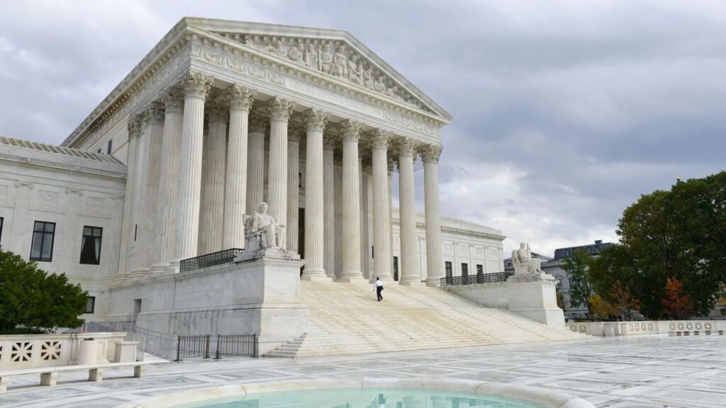 United States Supreme Court strengthens trump's immigration agenda with key rulings A panoramic view of the United States Supreme Court building, showcasing its massive walls and beautiful fountain