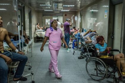 A hospital operating at full capacity, with numerous injured and sick patients following the disaster