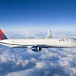 A Delta Air Lines aircraft flying through the sky