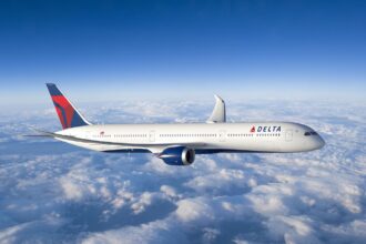 A Delta Air Lines aircraft flying through the sky