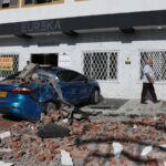 7.4 magnitude earthquake strikes Colombia and is felt in Ecuador and Panama A car and a road covered in debris after several buildings and small houses collapsed in the city of Cali