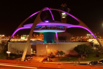 Alarm at LAX: Fire investigated after cargo plane lands A giant main tower at Los Angeles International Airport with many lights illuminating the outside of the structure