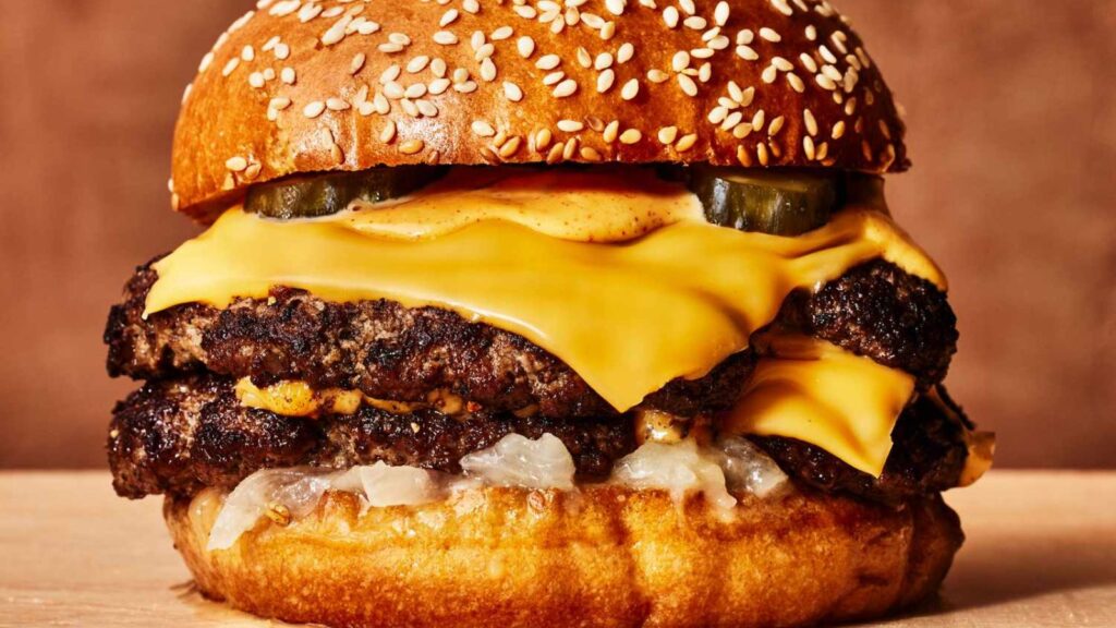 A delicious burger with double meat, sauce, and melted cheese