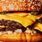 A delicious burger with double meat, sauce, and melted cheese