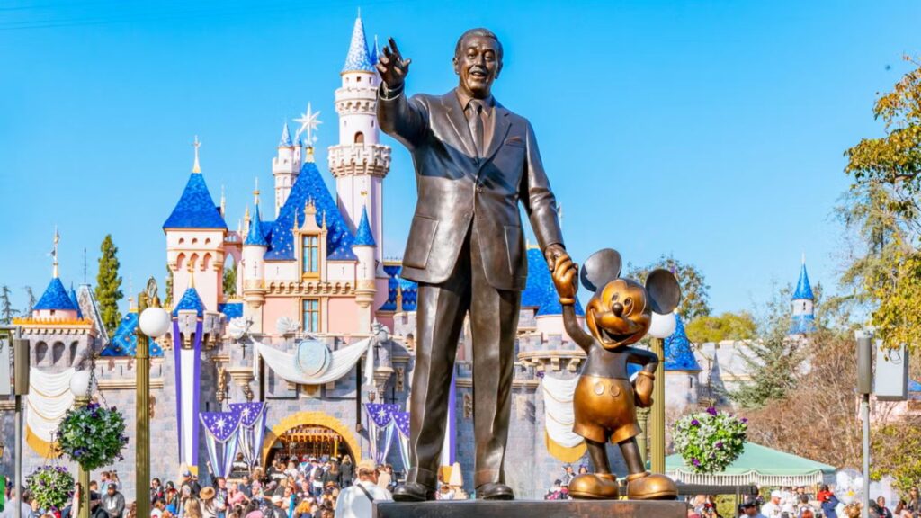 The story of Walt Disney holding hands with his most successful creation and drawing, Mickey Mouse