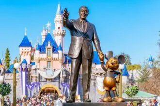 The story of Walt Disney holding hands with his most successful creation and drawing, Mickey Mouse