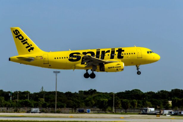 A Spirit Airlines plane taking off after departing from an airport runway