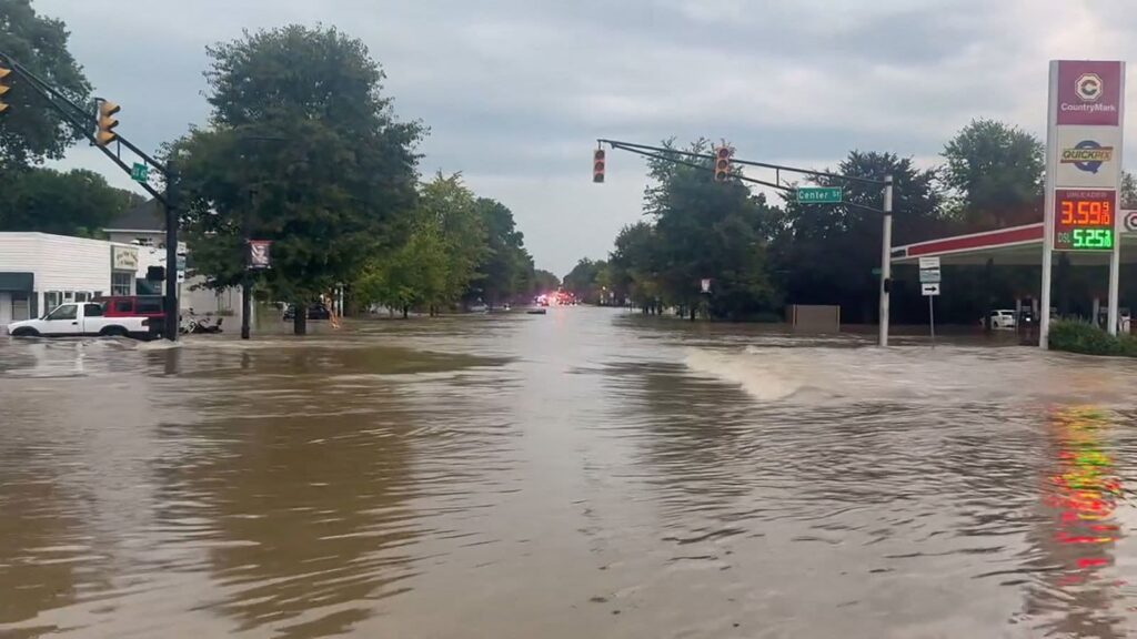 One of Indiana’s streets completely flooded, with the roads filled with water and impassable