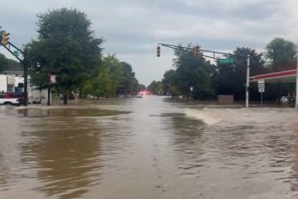 One of Indiana’s streets completely flooded, with the roads filled with water and impassable