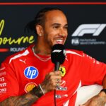 Lewis Hamilton apologizes to ferrari after controversial messages at the Dutch Grand Prix Hamilton sitting in a chair while being interviewed in his Ferrari uniform