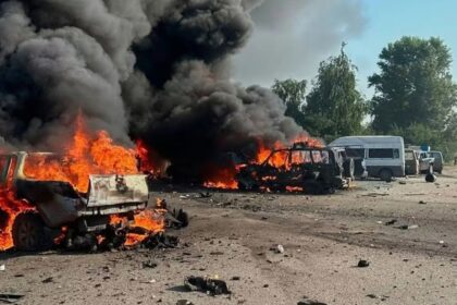 Two cars completely engulfed in flames following the attacks