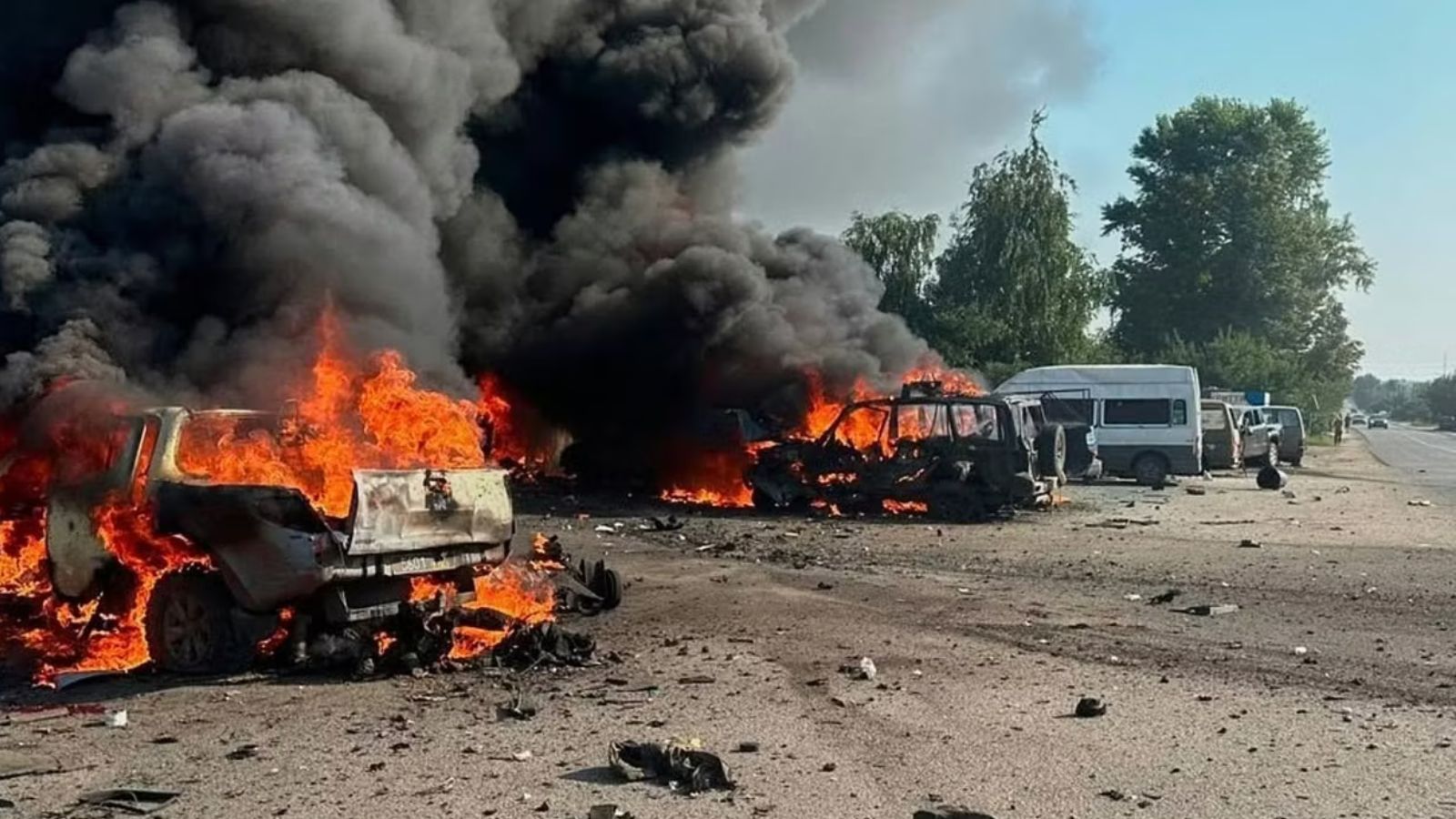 Two cars completely engulfed in flames following the attacks