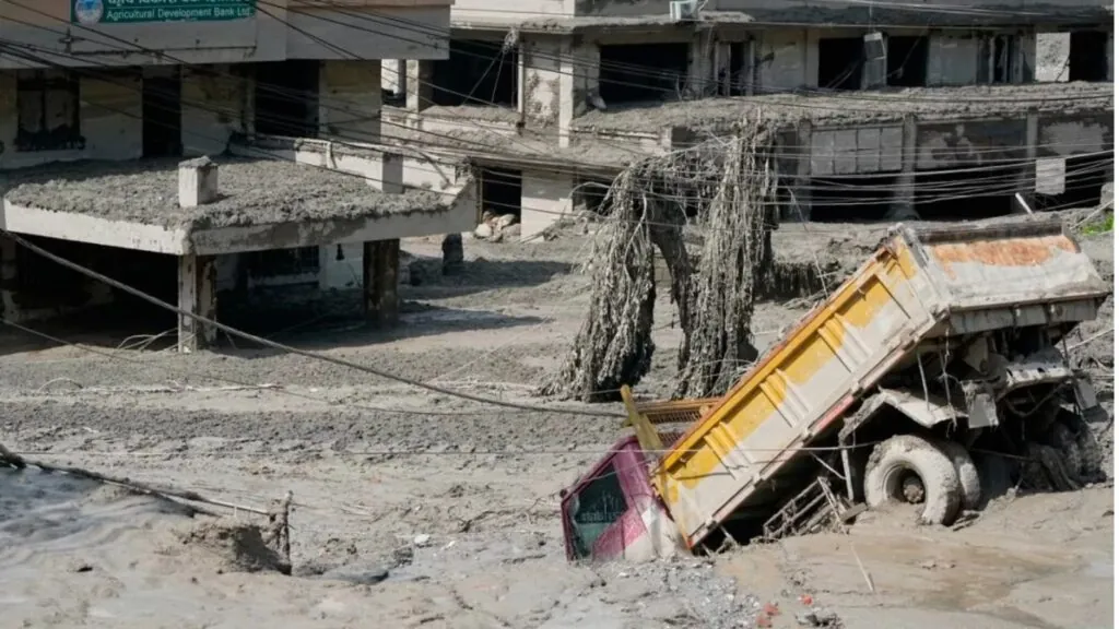 A Nepalese village completely submerged in mud, causing extensive damage to infrastructure