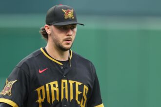 The incredible pitcher with a worried look on his face while standing on the mound